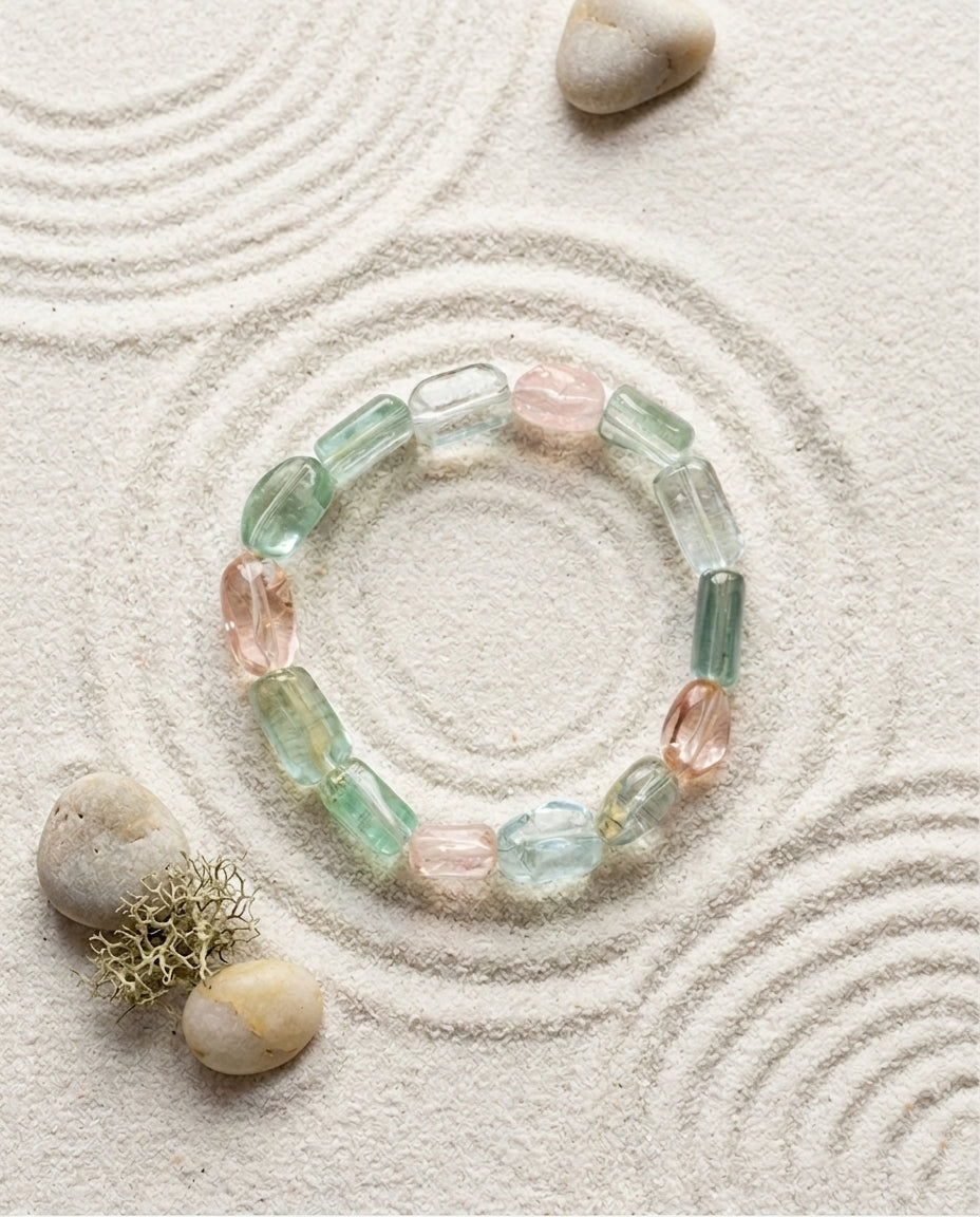 Natural mixed Beryl bracelet with Aquamarine, Morganite, and Green Beryl, high-clarity pastel gemstone jewelry, artisan handcrafted mineral bracelet, isolated on white background for jewelry product catalog.