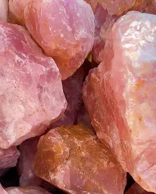 Close-up of raw pink rose quartz mineral specimen showing rugged natural crust and gemmy interior, wabi-sabi earth art and grounding stone decor by STILLMANTLE⁠