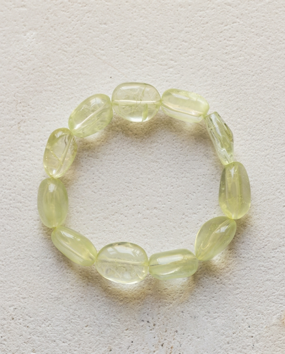 Macro close-up of a natural heliodor bracelet showing high transparency pale yellow contoured crystals, unheated luxury mineral jewelry.⁠