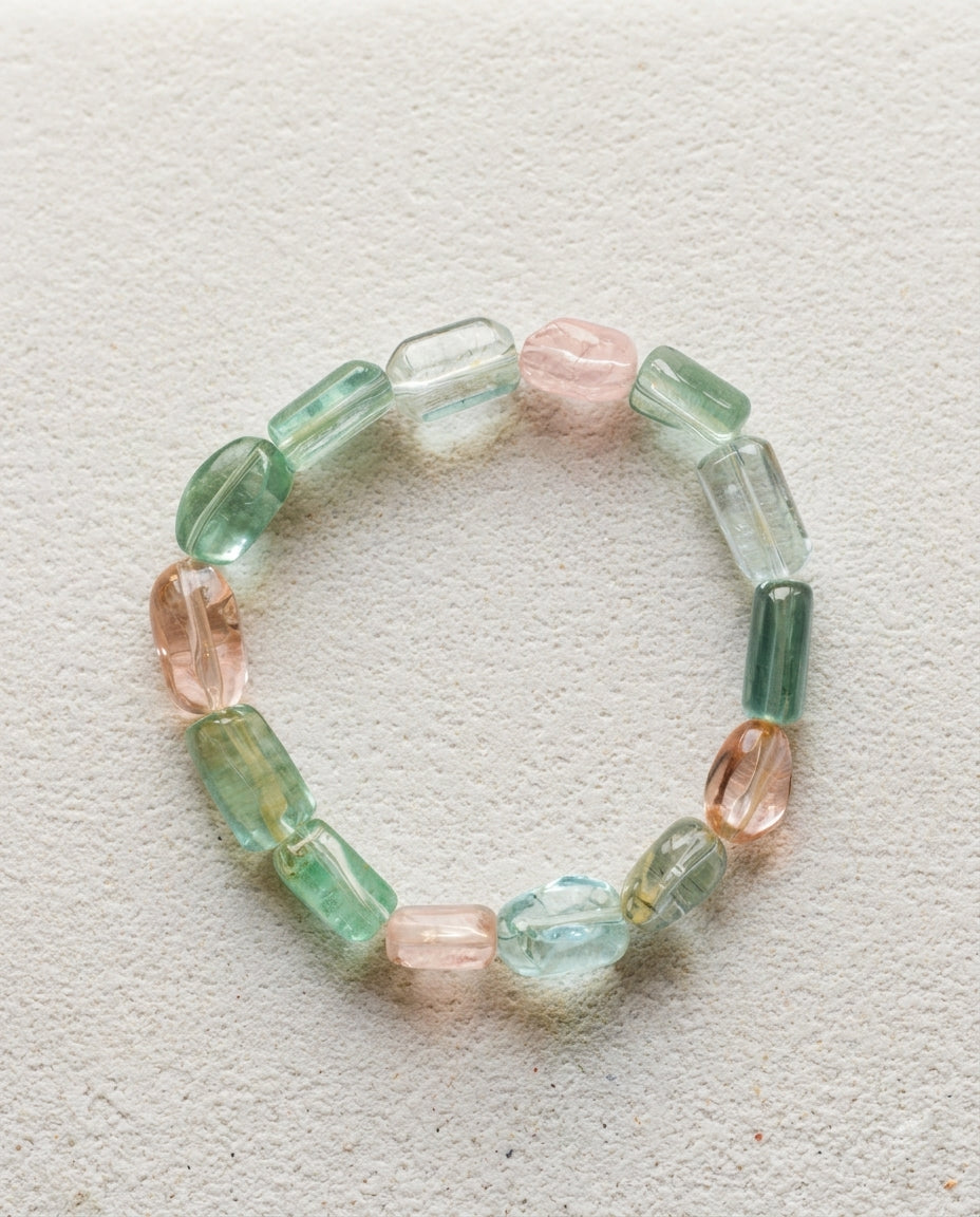 ⁠High-clarity mixed Beryl gemstone bracelet featuring natural Aquamarine and Morganite, styled on minimalist Zen garden sand ripples for wabi-sabi aesthetics.⁠