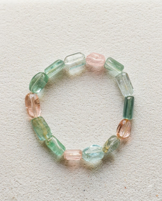 ⁠High-clarity mixed Beryl gemstone bracelet featuring natural Aquamarine and Morganite, styled on minimalist Zen garden sand ripples for aesthetics.⁠