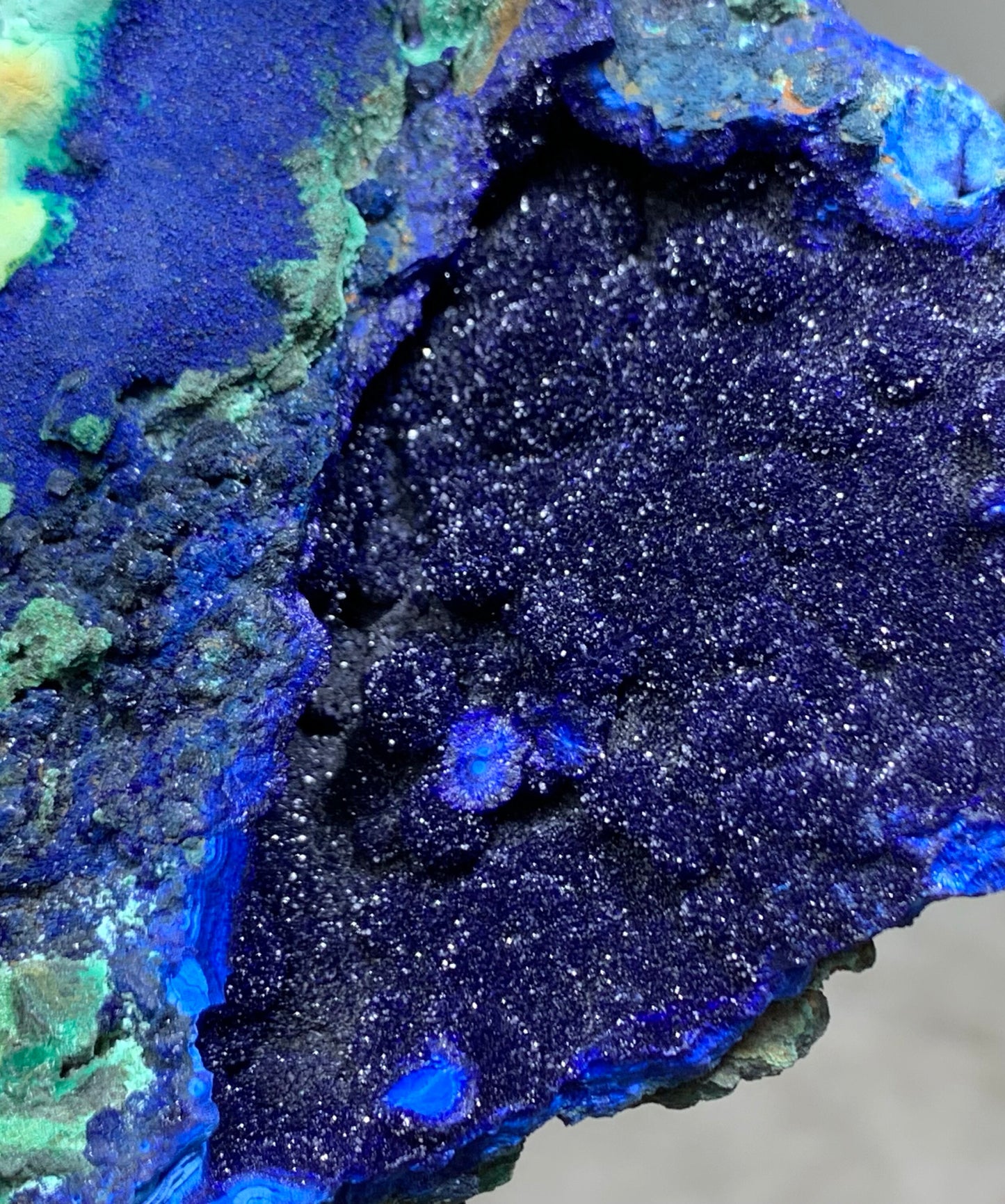 Extreme close up of sparkling raw azurite crystal cavity. Natural deep blue mineral stone detail for crystal collectors.⁠
